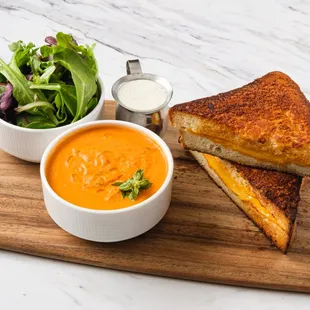 a grilled cheese sandwich and a bowl of soup
