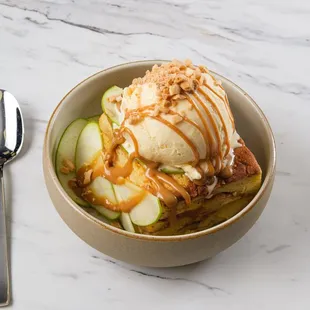 a bowl of ice cream and cucumbers