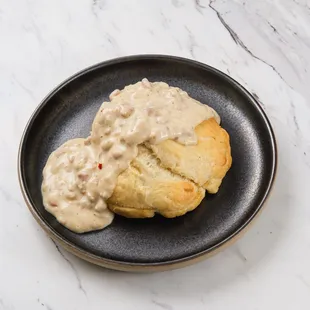 a plate of biscuits with gravy
