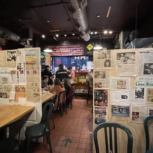 The Cool Interior of the restaurant with So Much Fun stuff on the walls from the 60s thru today @ Mr. Bartley&apos;s in Harvard Square Cambridge