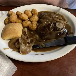 Hamburger steak, corn nuggets, coleslaw and a roll