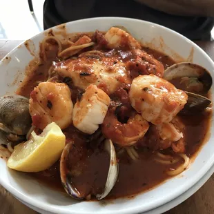 a bowl of seafood and clams