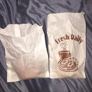 two bags of fresh daily donuts