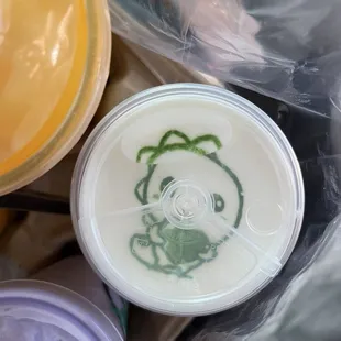 Jasmine Green Tea with Cheese Foam, super cute dinosaur on top!!