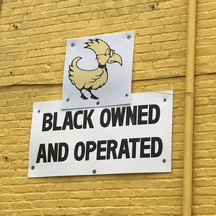 a black owned and operated sign