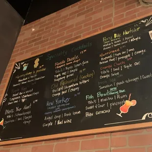 a menu on a brick wall
