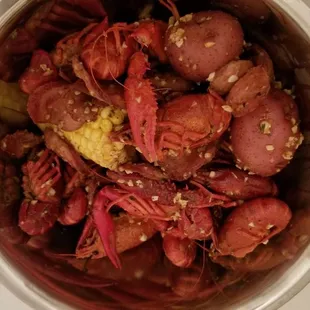 1 lb of crawfish with 1 COC, extra potatoes and 1/2 lb sausage in garlic butter w/ Old Bay.  Very good :)