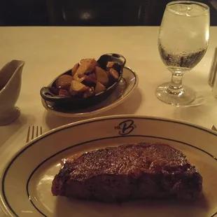 New York Strip and red potatoes with thick cut bacon.