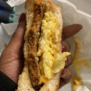 Hot sausage patty w/ cheese and egg on toast rolling
