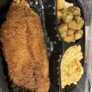 a meal of fried fish and macaroni and cheese