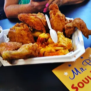 a plate of fried chicken and fries