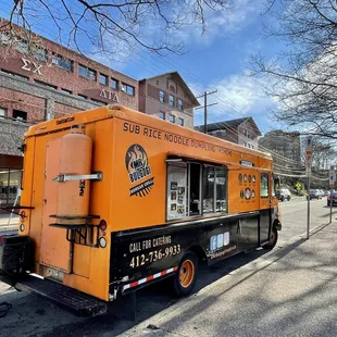 a food truck parked on the side of the road