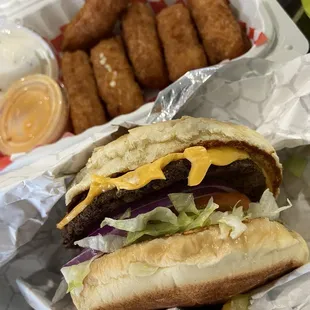 Bacon cheeseburger and mozarella sticks