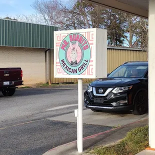 a car parked in front of a restaurant