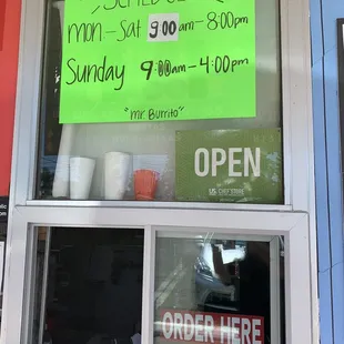 a sign in the window of a restaurant