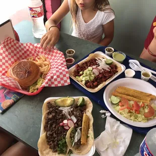 Flautas, carne asada and pastor tacos. And a hamburger. The flautas are