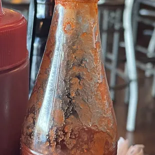 Unpleasant looking condiments on table.