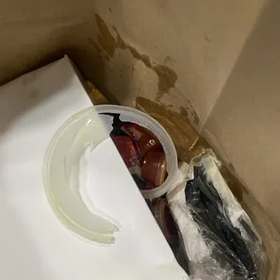 Broken lid that caused collard greens to spill in bag.