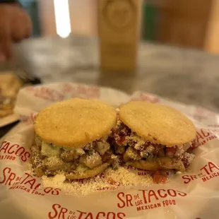 two sandwiches on a wrapper