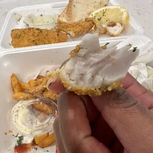 Undercooked pink catfish filet