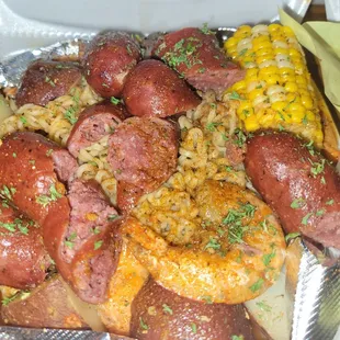 Ramen seafood plate:  noodles, shrimp, corn, sausage, and potatoes.