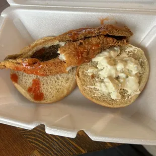 Flounder Fish sandwich after adding hot sauce and tarter. I broke the one piece of fish in two to try and make my sandwich seem fuller