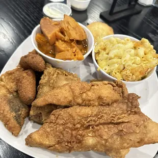 Fish and wings with mac, sweet potatoes, and hush puppies.