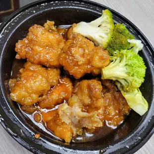 a bowl of chicken and broccoli