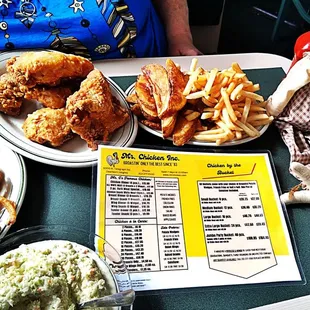 a table full of fried chicken and waffles