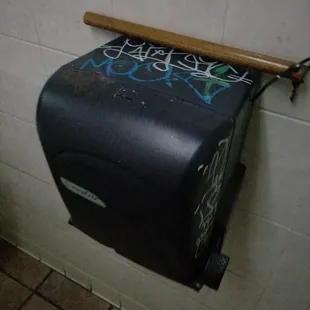a toilet with graffiti on it