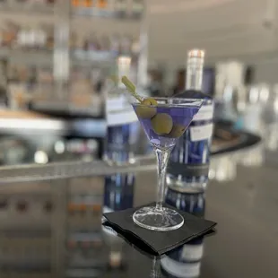 Delicious dirty blue martini