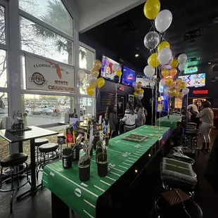a bar with a football field table