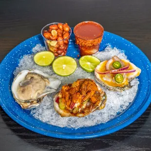 a plate of oysters and shrimp
