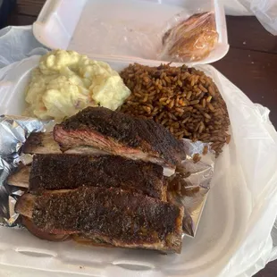 quarter rack with potato salad and rice