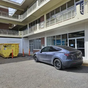 a car parked in front of a building
