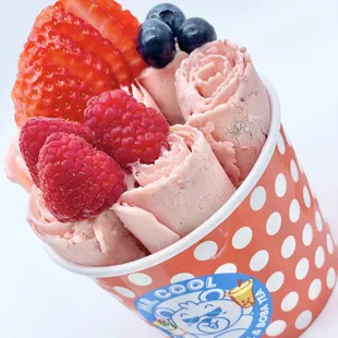 a cup of ice cream and berries