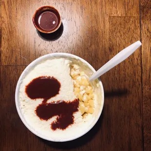 a bowl of mashed potatoes and sauce