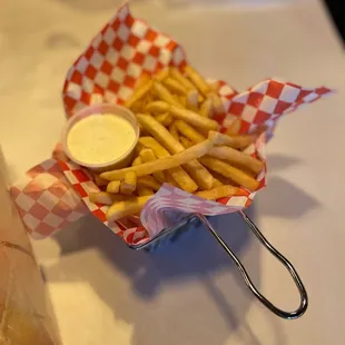 a basket of fries and a bag of fries