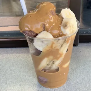 a cup of ice cream and bananas