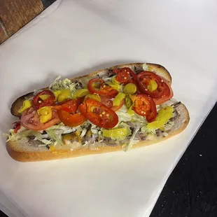 Large roast beef sub with hot peppers banana peppers