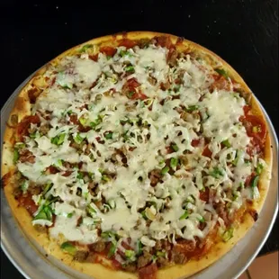 This is our updated menu as of July 2016 and a picture of one of our pizzas.