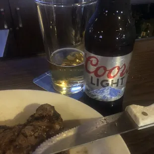 NY steak med rare - as ordered. Beer cold  served in frozen glass - lunch at the bar
