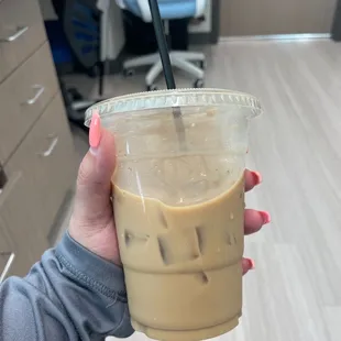 Iced Americano coffee w/half sweet hazelnut flavor *chef&apos;s kiss*