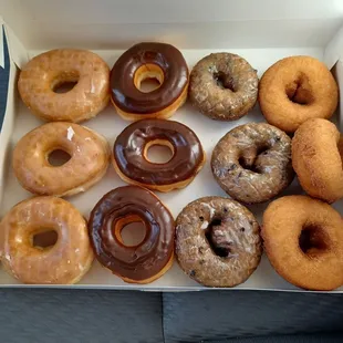 $11.90, tax included for mix dozen. Plain glazed, chocolate cover glazed, blueberry cake glazed, and plain cake.