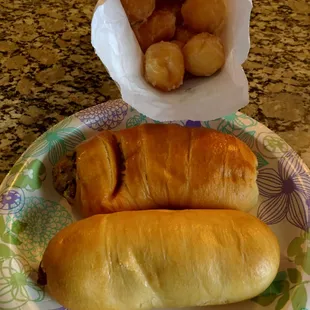 Medium Sausage and Cheese Kolache, Boudin Kolache and a bag of donut holes