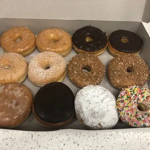 A dozen fresh donuts for $9.00. Delightful!