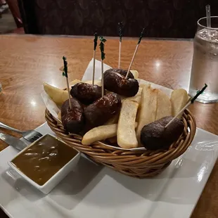 a basket of appetizers and dips