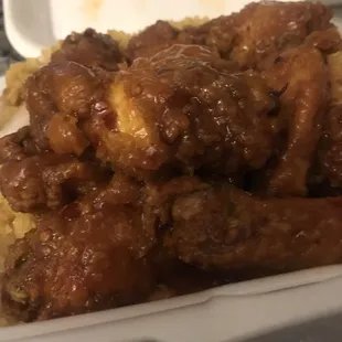 Chicken wings in Mr. Dragon&apos;s sauce and shrimp fried rice. Advertised as spicy. Very mild!