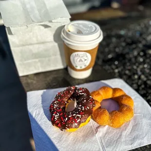 two donuts and a cup of coffee