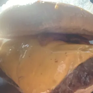 a close up of a cheeseburger